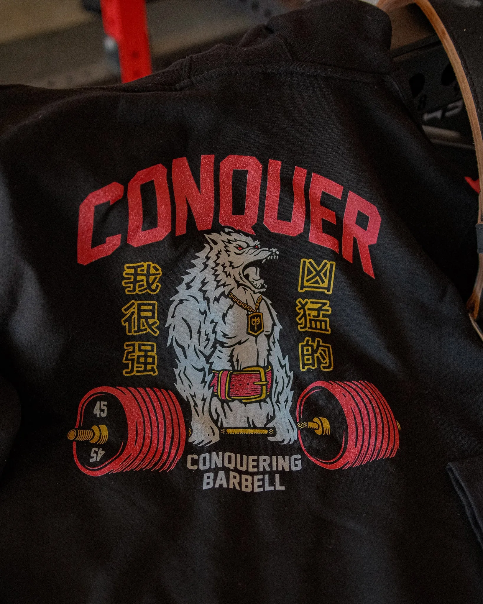 Conquer - Deadlifting Wolf V2 - on Black Pullover Hoodie